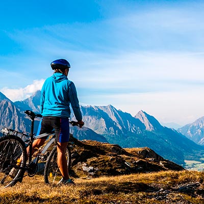 A traveller exploring the Dolomites by bike